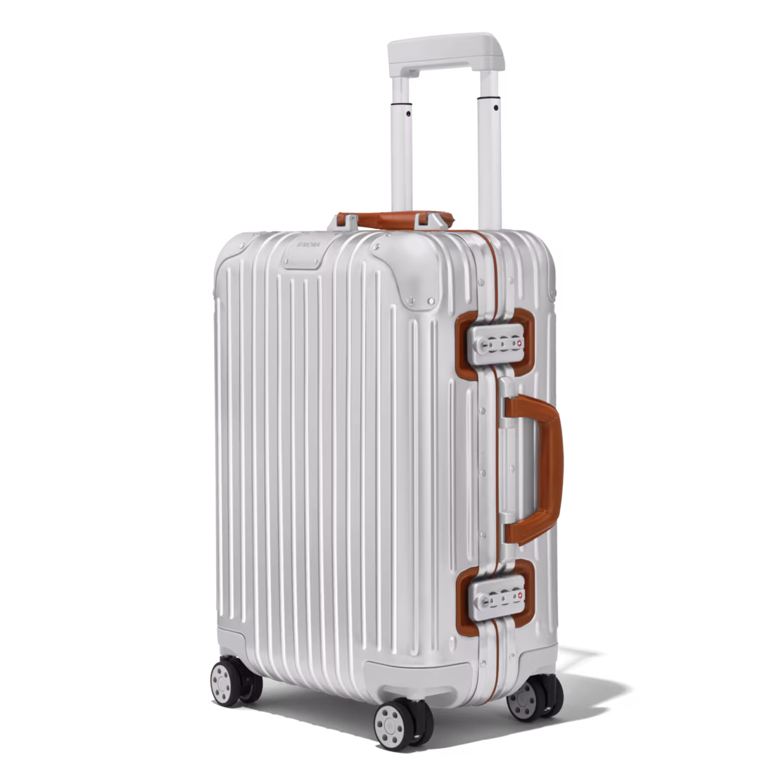 A silver aluminium Rimowa cabin case with brown leather handles and telescopic handle extended